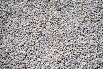 Close-up of white decorative gravel surface. Texture for landscaping, garden design or modern architectural background. Real photo