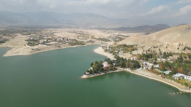 Aerial View of Qargha Water Reservoir, Afghanistan. Lake and Lakefront Buildings, Drone Shot