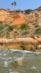 Spanish rocky seashore. Yellow Rocks and the Sea