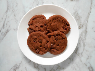 Double dark Chocolate chip cookies on white plate
