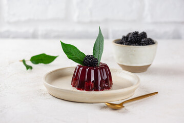 Cherry jelly with fresh blackberries, agar agar and green cherry leaves. Summer dessert, gelatin free.