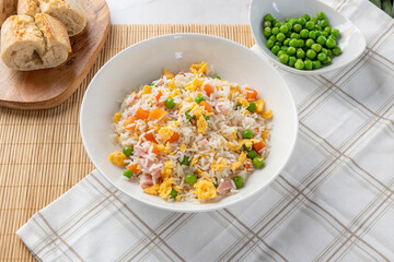 Fried rice bowl with ham egg peas carrots