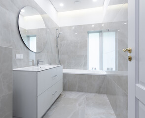 Modern Minimalist Bathroom Interior with Elegant Fixtures and Neutral Tiled Design