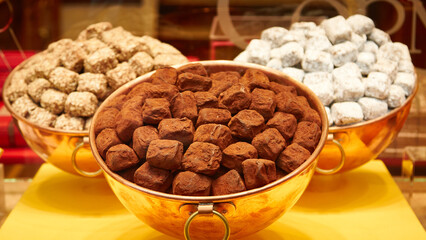 Assorted chocolate truffles displayed in elegant bowls, featuring rich textures and colors, showcasing a variety of flavors and styles, perfect for dessert lovers and gourmet enthusiasts
