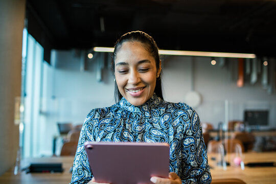 Young woman using tablet in office