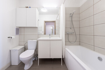 Modern Home Bathroom Interior With Bathtub, Sink, Toilet, and Minimalist Decor