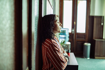 Woman reflecting while on a break from a group therapy session