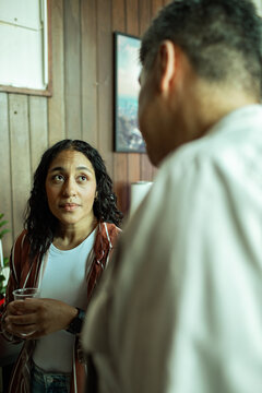 Man and a woman having a conversation while on a break from a group therapy session