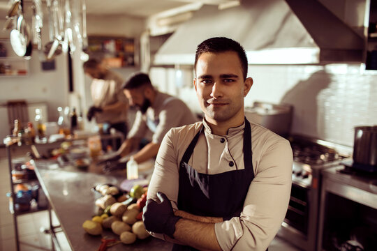 Young adult chef in restaurant kitchen