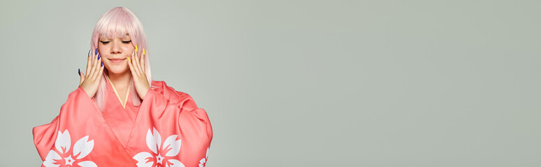 Young woman in trendy kimono enjoying a serene moment in a minimalist setting