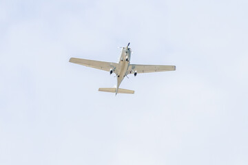 Small plane. A single engine plane crosses the blue sky. Transportation.