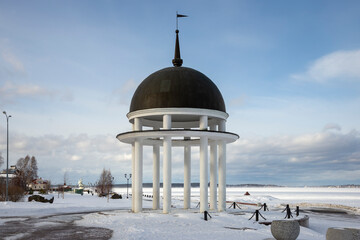 Gazebo on the embankment of Lake Onega on a March day, Petrozavodsk. Republic of Karelia, Russia