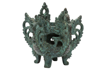 Ornate vintage bronze censer with a green patina finish isolated on a transparent background
