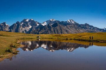 Kuruldi Lakes With View Of Snow Capped Caucasus Mountains Near Mestia Georgia: Scenic Alpine Landscape With Clear Water And Majestic Peaks