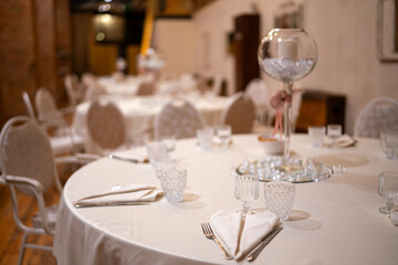 Elegant Wedding Banquet Hall Ready for Celebration with Beautifully Set Tables and Floral Centerpieces