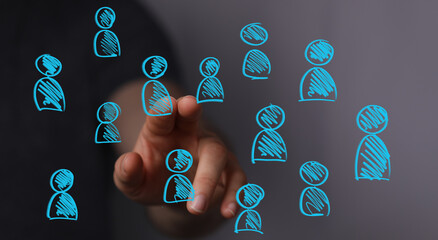 A hand interacts with a digital display of glowing user icons, symbolizing online community, business networking, and social media connections.