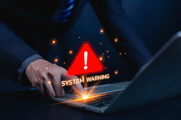 Cybersecurity alert concept with businessman touching laptop showing red system warning sign. Computer security breach, data protection risk, and digital system error notification concept.