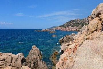 Landscape of Costa Paradiso, Sardinia, Italy. A picturesque coastline with red cliffs, hidden coves, and crystal-clear waters, perfect for nature lovers and those seeking tranquility