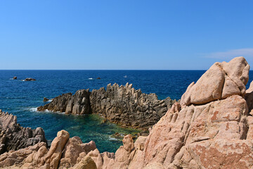Landscape of Costa Paradiso, Sardinia, Italy. A picturesque coastline with red cliffs, hidden coves, and crystal-clear waters, perfect for nature lovers and those seeking tranquility