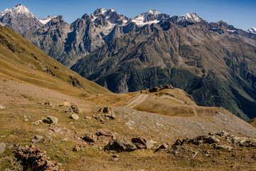 Mountain Summits Around The Ushba Region In The Caucasus Range Of Georgia: Scenic Alpine Landscape With Hiking Trail And Snow Capped Peaks