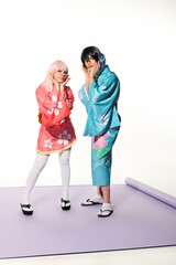 Fototapeta premium Youth couple express anime culture enthusiasm through bright costumes