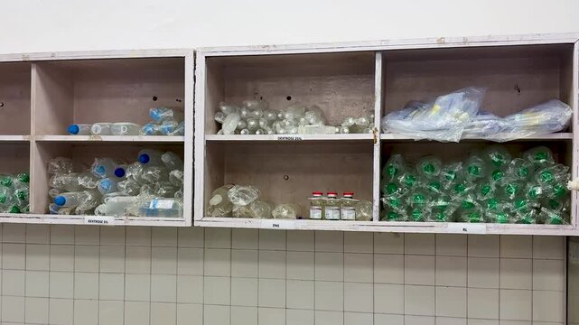 hospital pharmacy area storing dextrose dns and rl iv bottles