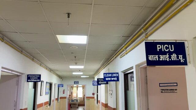 healthcare facility interior corridor showing picu and pediatric ward signage