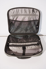 Travel bag organizer open showing compartments for accessories and devices