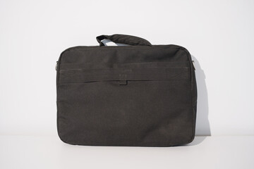 Simple black laptop bag displayed on a clean background