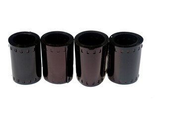 rolls of photographic film, a strip of transparent plastic film coated with a light sensitive emulsion, that forms a latent image when exposed to light, then chemically developed to create photograph