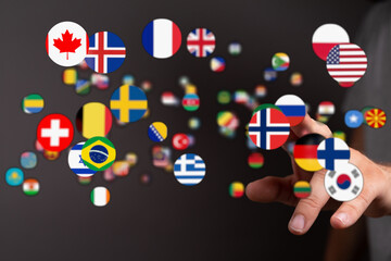 A diverse collection of country flags floating and connected by a hand symbolizing global unity, international collaboration, and connection acr
