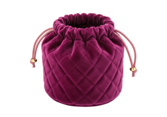 Isolated purple quilted velvet drawstring bag for jewelry or cosmetics in studio light