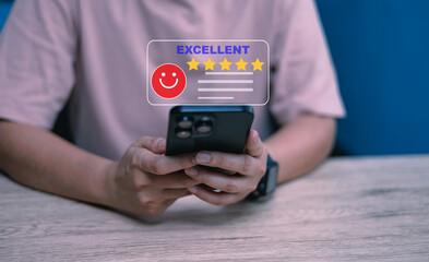 User holding smartphone with excellent five-star rating feedback message interface, Concept of online review, customer satisfaction, and digital service quality evaluation