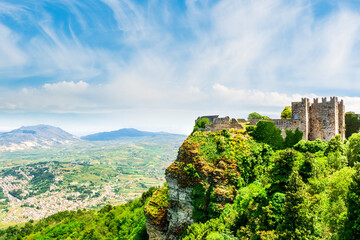 panoramic view of summer season landscape from above of beautiful valley with green fields and blue sea coast. Aerial view with amazing coastline hills and mountains.