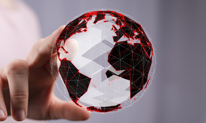 Hand holding digital earth, representing global network, technology, and connection.