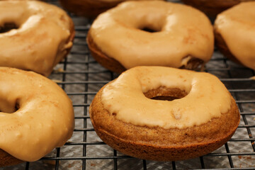 Fresh Homemade Pumpkin Spice Donuts on Wire Rack