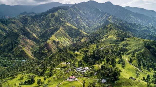 Green rolling hills and valleys with a small village tucked among trees and winding roads.