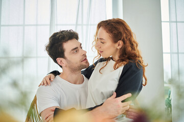 Fototapeta premium Couple enjoys a cozy weekend together at home, bright moments of love and laughter