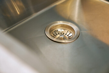 Kitchen sink drain showing clean stainless steel design