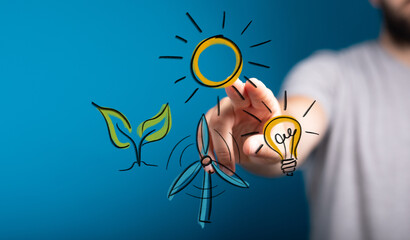 Hand interacting with eco-friendly icons: sun, plant, wind turbine, lightbulb.  Concept:  Clean...