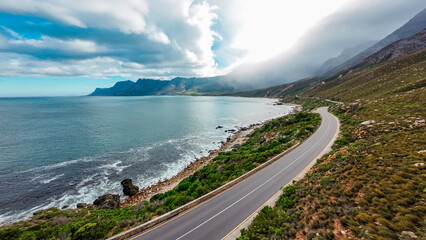 Aerial photography in South Africa, mountains shrouded in clouds and fog along the coastal highway