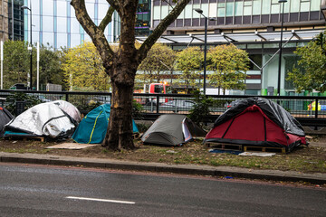 Tents of homeless people along Euston Road, London, highlighting urban poverty and rising homelessness in the UK capital. © Jon