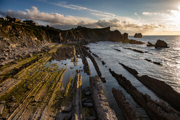 Discover the stunning beauty of Barrika beach in Basque Country, Spain at sunset, perfect for travel blogs, coastal lifestyle themes, and serene nature backgrounds © Gabriel