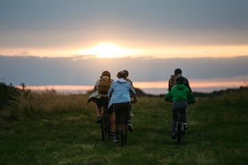 Family biking adventure in nature. Cycling trip during autumn day.