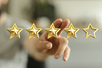 Person selecting 5 star rating. Symbol of feedback, evaluation, success, achievement, and excellent service. Customer review and quality concept