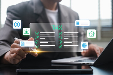 businessman organizing tax checklist through virtual interface using tablet and laptop, concept of finance planning, e-filing, compliance, and managing digital financial workflow