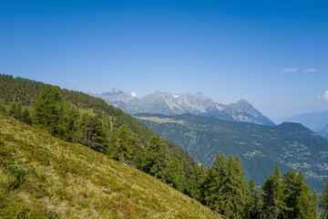 This landscape photo was taken in Europe, France, Auvergne Rhone Alpes, Haute Savoie, in summer. We can see the mountains, under the Sun.