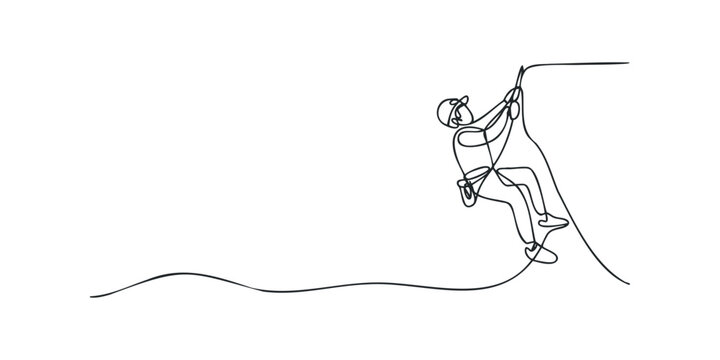 Person climbing up steep rock face with rope