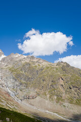 This landscape photo was taken in Europe, France, Auvergne Rhone Alpes, Haute Savoie, in summer. We can see the mountains, under the Sun.