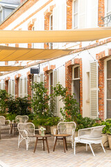 Outdoor patio furniture under shade sails in Epernay